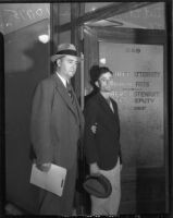 Detective Lieutenant Leroy Sanderson escorts Thomas Edward Dugger who was on trial for the physical and sexual assault of three women, Los Angeles, 1935-1936