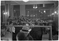 Patrons playing cards in a casino, Los Angeles, 1937