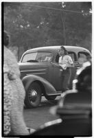 Drive-in waitress taking an order from a customer, Los Angeles, 1937