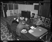 LACRA workers rest on a desk during a strike, Los Angeles, 1930s