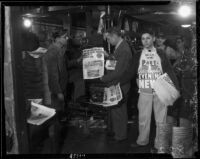 E. Manchester Boddy, publisher of the Los Angeles Daily and Evening News, photographed with newspaper employees, Los Angeles, 1936