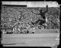 Jesse Owens pictured in a broad jump midair, Los Angeles, 1930s