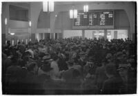 Spectators place their bets on opening day of Santa Anita's fourth horse racing season, Arcadia, December 25, 1937