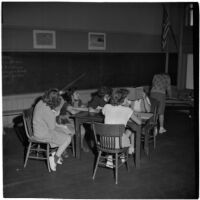 Six girls sitting around a table in a classroom, Los Angeles, March 1946