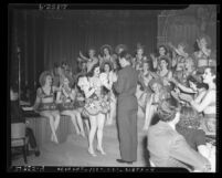 Earl Carroll and his dancing girls at California Amusement Machine Operators Association Party in Los Angeles, Calif., 1939