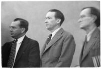 Murder suspect Robert S. James standing between two unidentified men in court, Los Angeles, 1936