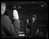 Bernadette Doyle being sworn in at State Senate Education Committee's Communism inquiry, Pasadena, 1950