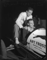 Race car driver Rex Mays poses with fellow driver Bob Swanson at the Legion Ascot speedway, Los Angeles, 1935