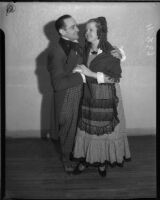 Two opera singers pose for La Boheme at the Shrine Auditorium, Los Angeles, 1935