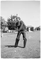 LA Daily News city editor Charles Judson demonstrates improper golf swings for a tutorial series with golfer Fay Coleman. Circa 1940