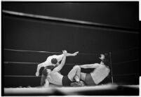 Heavyweight wrestler El Pulpo grappling with an opponent at the Olympic Auditorium, Los Angeles, 1937