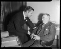 Film actor Clark Gable speaking with his father W.H. Gable, Los Angeles, 1937