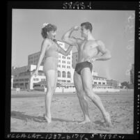 Ed Holovchik [aka Ed Fury], bodybuilder and Mr. Los Angeles contestant with model Jackie Coey, 1953