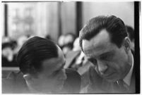 Accused murderer Paul A. Wright conferring with an attorney in court, Los Angeles, 1938