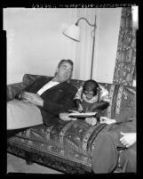 Reporter Bill McPhillips with J. Fred Muggs, chimp star of NBC's "Today" television show, 1954