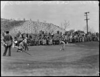 Golfer putts on the green at the 12th annual Los Angeles Open golf tournament, Los Angeles, 1937