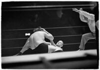 Wrestlers "Daniel Boone" Savage and Hans Steinke battle it out at the Grand Olympic Stadium. June 16, 1937