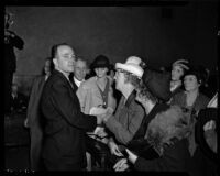 Self-proclaimed benefactor of the elderly Robert Noble, surrounded by some of his followers in the courtroom where he is charged with several misdemeanors, Los Angeles, 1937-1938