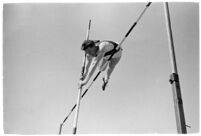 USC high jumper in mid-leap at a meet, Los Angeles, 1937