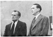 Murder suspect Robert S. James standing next to an unidentified man in court, Los Angeles, 1936