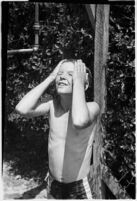 Boy takes part in a free summer camp organized by Los Angeles Sheriff Eugene Biscailuz. Circa July 1937