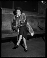 Radio singer Virginia Verrill awaiting violinist David Rubinoff in a lobby, Los Angeles, 1937