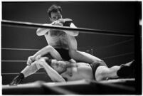 Wrestling match between Italian newcomer Vincent Austeri and Salt Lake City native Del Kunkel at Olympic Auditorium, Los Angeles, 1938