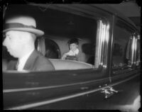 Eleanor Roosevelt rides in a vehicle during a motor parade, Los Angeles, 1935