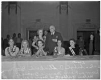 Governor Frank Finley Merriam and Adele Arbo stand behind five young beauty contestants, Los Angeles, 1930s