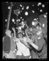 Michigan State students celebrating on float at Tournament of Roses Parade in Pasadena, 1954