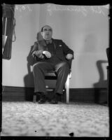 Sol Zemansky waits in a chair at the grand jury trial on gambling conditions, Los Angeles, 1935