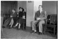 Private detective Pearl Antibus appears in court with her daughter Norma Thelan and son Robert Antibus during her trial against millionaire Thomas W. Warner, Sr, Los Angeles, 1938