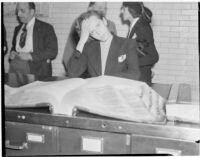 Betty Flay Hardaker stands at a counter in the Los Angeles County Jail after being taken into custody, Los Angeles, 1940