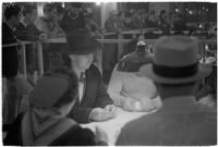 Patrons playing cards in a casino, Los Angeles, 1937