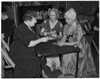 Mrs. Ellwood K. Lightholder, Mrs. Henry H. Robinson, and Mrs. John H. Harris, clubwomen playing cards, Los Angeles, circa 1940