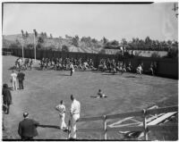 UCLA football players running at Spaulding Field on opening day of the season, Los Angeles, September 1937