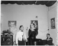 Female impersonator Johnnie David preparing to sing with an unidentified man, Hollywood, circa 1937