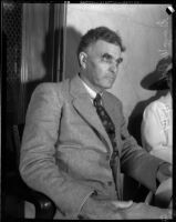Board of Education member George W. McDill sitting in a room, Los Angeles, 1935