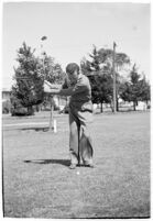 Golfer Fay Coleman demonstrates a series of "right" and "wrong" golf swings