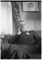 German author Thomas Mann seated in a chair, Los Angeles