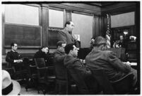 Defense attorney Jerry Giesler in court during the trial of accused murderer Paul A. Wright, Los Angeles, 1938