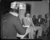 William A. Hudson testifies before the coroner's jury for murder charges brought against Busby Berkeley for drunk driving, Los Angeles, 1935