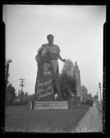 Billboard reading "They must Live…in Freedom! United Jewish Welfare Fund" with "KKK" painted over "Jewish" on Wilshire Blvd. in Los Angeles, Calif., circa 1948