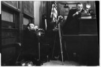 Bank of photographers in the courtroom during the trial of accused murderer Paul A. Wright, Los Angeles, 1938