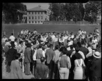 Jesse Owens surrounded by a crowd, Los Angeles, 1930s