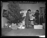 Three women preparing Christmas gifts at Los Angeles Indian Center, 1949