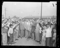 Six civic leaders and boys at groundbreaking ceremony for Eastside Boys' Club in Los Angeles, Calif., 1953