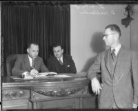 Judges Joseph L. Call and Cecil D. Holland convene in a courtroom, Los Angeles, 1934