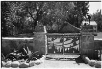 Gate marking the entrance to 4-year-old Gloria Lloyd's private mini-estate on her parent's sixteen-acre estate, Beverly Hills, 1927