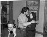 Cowboy film extra Jerome "Blackjack" Ward with his wife Mickey during a re-enactment of his confrontation with fellow extra Johnny Tyke, Los Angeles, February 24, 1940